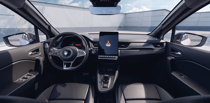 Modernes, schwarzes Cockpit des Mitsubishi Grandis mit Multifunktionslenkrad und gro&szlig;em, hochformatigem Touchscreen in der Mittelkonsole, die Blickrichtung verl&auml;uft von den Vordersitzen nach vorne.