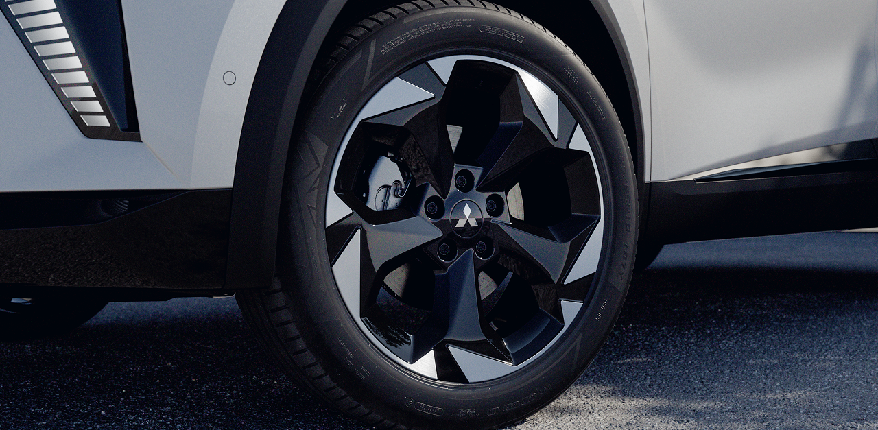 Detailaufnahme der vorderen Lichtanlage und Felge.