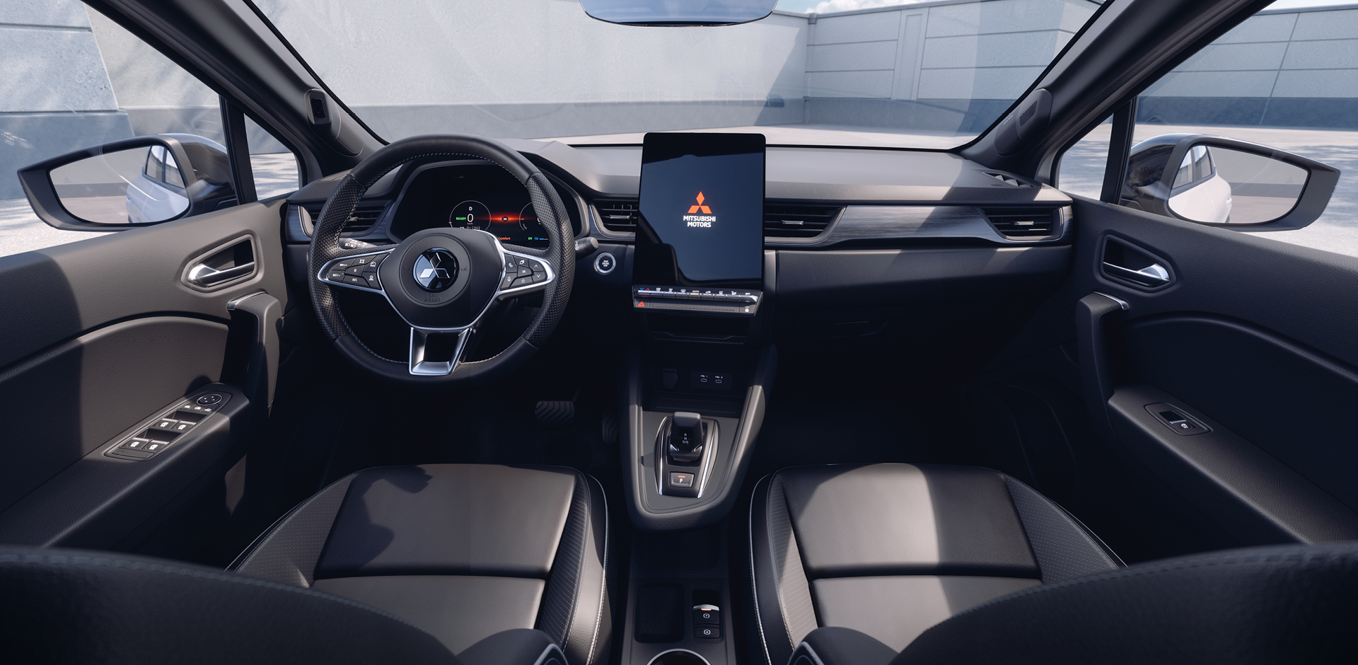 Modernes Cockpit des Mitsubishi Grandis mit Multifunktionslenkrad und gro&szlig;em, hochformatigem Touchscreen in der Mittelkonsole.
